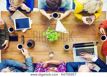 Multiethnic People with Startup Business Talking in a Cafe