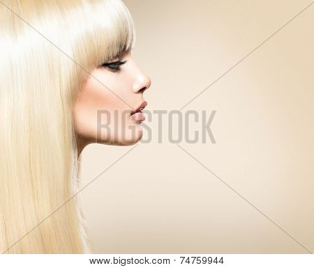 Blond Hair. Blonde Beauty girl with long smooth shiny hair. Fringe Haircut. Beautiful Girl with Healthy Long Hair. Hairstyle 