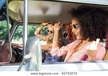 Happy friends on a road trip on a summers day