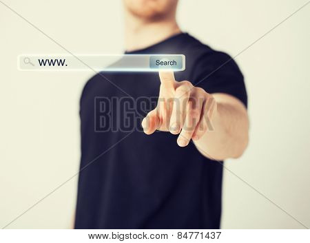 technology, searching system and internet concept - male hand pressing Search button