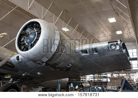 DAYTON, OHIO, USA-NOVEMBER 18, 2016:National Museum USAF is restoring famousoriginal WWII Memphis Belle B-17F Flying Fortress bomber left radial engine & partial wing shown here in restoration hanger.