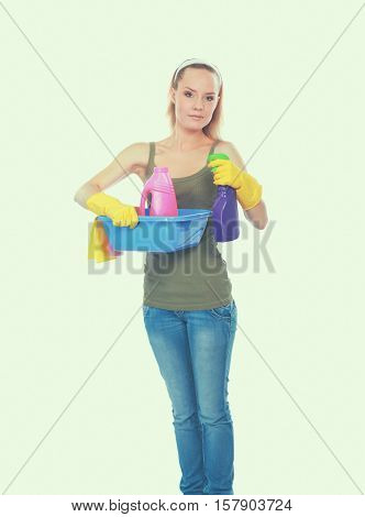 Cheerful woman is cleaning something with wisp and spray attentively