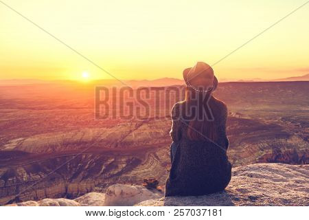 A Girl In A Hat On Top Of A Hill In Silence And Loneliness Admires A Tranquil Natural Landscape In S