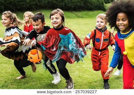 Little children trick or treating on Halloween