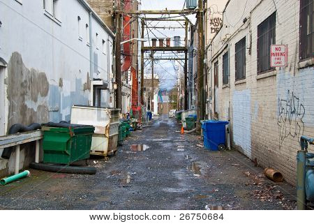 Looking down a long dark back alley.