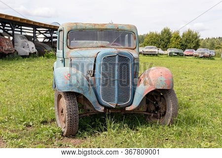 Mozhaisk, Russia - August 11, 2019: Old Abandoned Rusty Vehicles, Crushed Cars In Scrapyard, Junk Ya