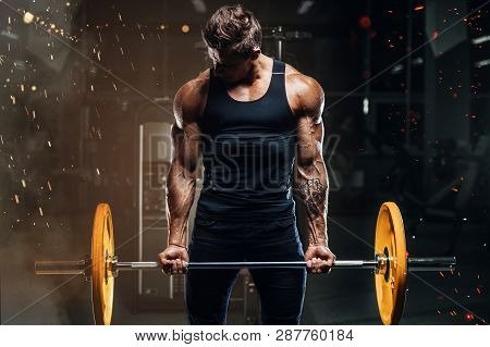 Handsome Strong Athletic Fitness Men Pumping Up Arm Muscles Workout Barbell Curl Fitness Concept Bac