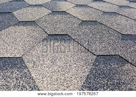 Asphalt Shingles Soft Focus Photo. Close up view on Asphalt Roofing Shingles Background. Roof Shingles - Roofing Construction, Roofing Repair.