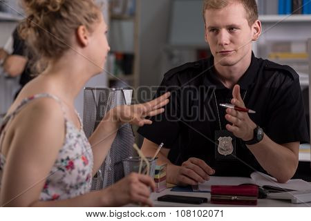 Police Officer Interrogating Woman