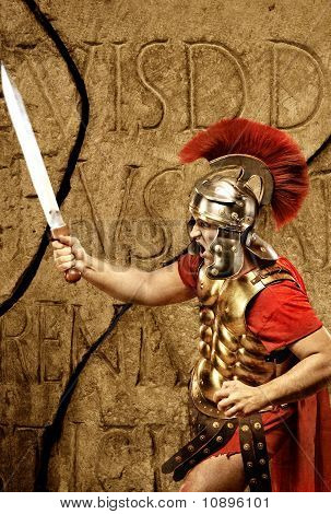 Roman legionary soldier in front of abstract wall