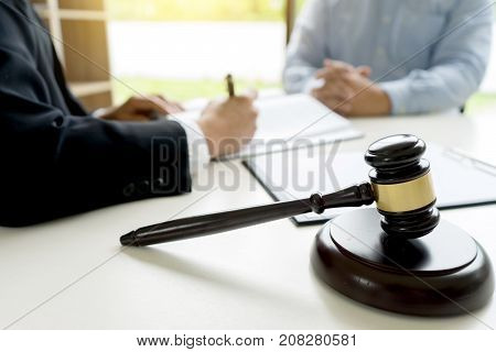 Judge Gavel With Justice Lawyers Plaintiff Or Defendant  Meeting