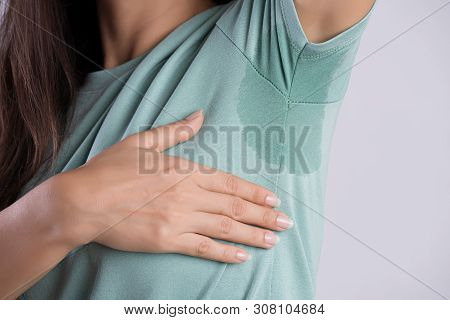 Close-up Asian Woman With Hyperhidrosis Sweating. Young Asia Woman With Sweat Stain On Her Clothes A