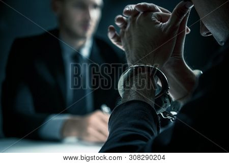 Criminal Man With Handcuffs In Interrogation Room Feeling Guilty After Committed A Crime