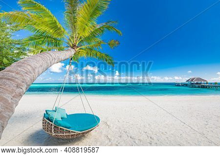 Tropical Beach Paradise As Summer Landscape With Beach Swing Or Hammock And White Sand, Calm Sea For