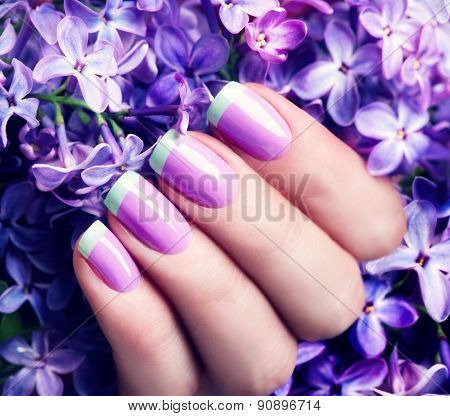 Manicured nails Nail Polish art design. Violet with green colors Art Manicure. Nail Polish. Beauty hands. Fashion Stylish Trendy Colorful Nails 