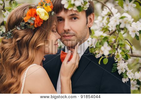 The bride and groom - photo in a flowery Park in the spring.