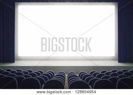 Movie theater with blank mock up screen. Cinema auditorium with white copy space screen. Rows of seats in cinema theater. Mock up 3D Rendering