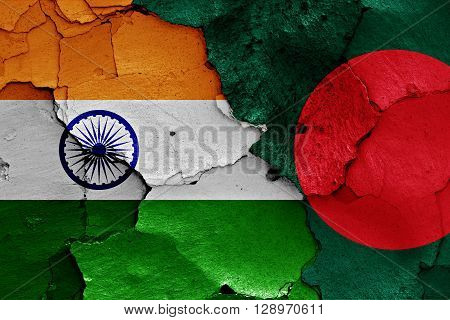 flags of India and Bangladesh painted on cracked wall