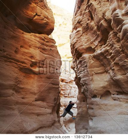 girl climbing in the canyon walls