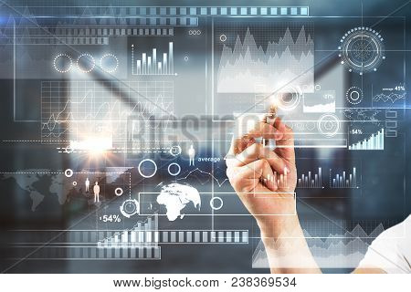 Businessman Hand Pointing At Abstract Digital Business Interface Hologram On Blurry Office Interior 