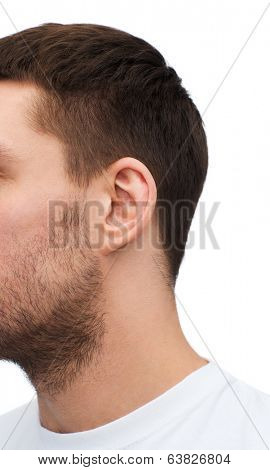 health and body parts concept - close up of male ear