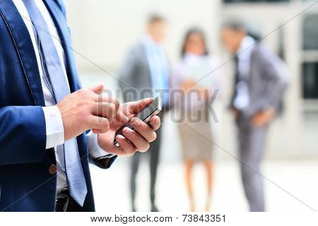 Close up of a man using mobile smart phone