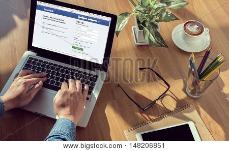 Bangkok, Thailand - Mar 10, 2015: Man On A Computer Browsing Facebook