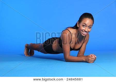 Plank Ab Exercise By Happy African American Woman