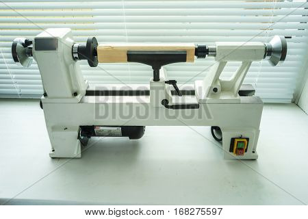 Woodworking Machine, Mini Woodworking Lathe Close Up Detail, Wood Shavings Tools, Woodworking Machinery, Small Woodwork Lathe in a Joinery Workshop, Woodwork on the Machine, Spindle Turning