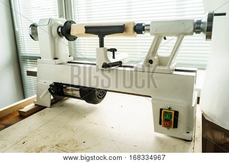 Woodworking Machine, Mini Woodworking Lathe Close Up Detail, Wood Shavings Tools, Woodworking Machinery, Small Woodwork Lathe in a Joinery Workshop, Woodwork on the Machine, Spindle Turning