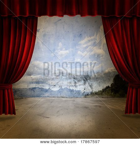 Small stage with red velvet theater curtains