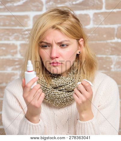 Girl Sick Person Hold Nasal Drops And Tissue. Allergy Concept. Home Treatment. Effective Nasal Spray