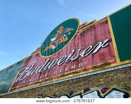 BARNES, LONDON - JANUARY 11, 2019: Retro Budweiser beer advertising sign on a derelict building in Barnes, West London, UK.