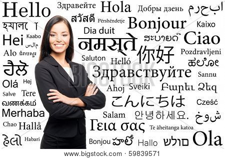 Young attractive woman over the background with a different world languages (language school concept)