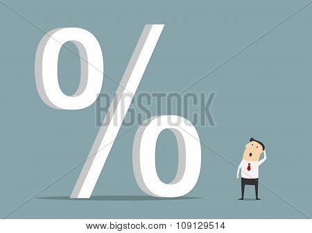 Businessman looking up at big percent symbol