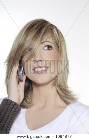 Young Blond Smilling Woman Holding A Phone