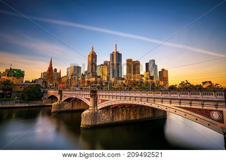 MELBOURNE, VICTORIA,  AUSTRALIA - JANUARY 28, 2017 : Sunset over city skyline of Melbourne downtown, Princess Bridge and Yarra River. Long exposure.