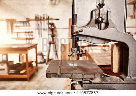 Well-used jig saw machine in a woodwork workshop