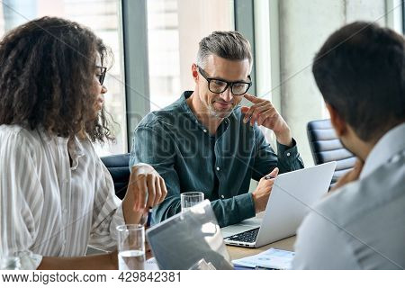 Diverse International Executive Business People Working On Project At Boardroom Meeting Table Using 