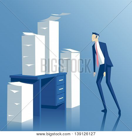 business concept paper work a tired businessman looking at the office desk with stacks of paper tired employee looks at the pile of papers on his table