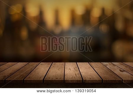 wooden table with a view of blurred beverages bar backdrop