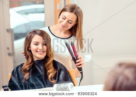 Beautiful woman in hair salon