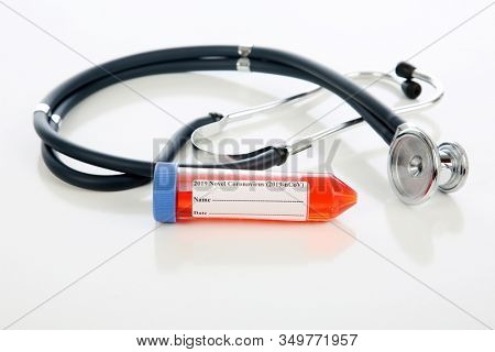 2019 Novel Coronavirus. 2019-nCoV. Wuhan, China 2019 Novel Coronavirus. Stethoscope with vial of blood containing the 2019 Novel Coronavirus. Isolated on white. Room for text. Coronavirus is bad. 