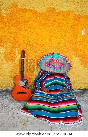 Mexican typical lazy man sombrero hat guitar serape nap siesta