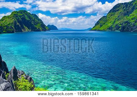 Beautiful tropical sea bay. Scenic landscape with mountain islands and blue lagoon El Nido Palawan Philippines Southeast Asia. Exotic scenery. Popular landmark famous destination of Philippines