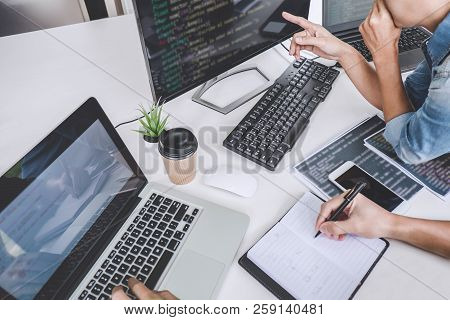 Writing Codes And Typing Data Code Technology, Programmer Cooperating Working On Web Site Project In