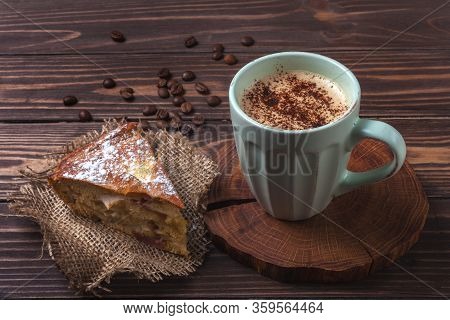 Cup With Coffee And Apple Pie On A Rural Wooden Tabletop. Latte Or Cappuccino With Chocolate Sprinkl