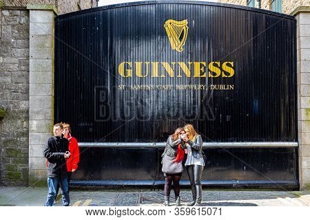 Dublin, Ireland - April 22, 2016: Street View Of People In Front Of The Historic Old Factory Buildin