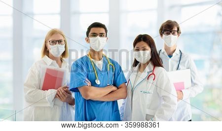 International Doctor Team. Hospital Medical Staff. Mixed Race Asian And Caucasian Doctor And Nurse M