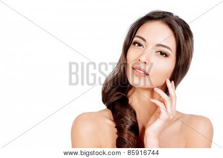 Beautiful sensual woman touching her face. Beauty and skincare concept. Spa. Isolated over white. 